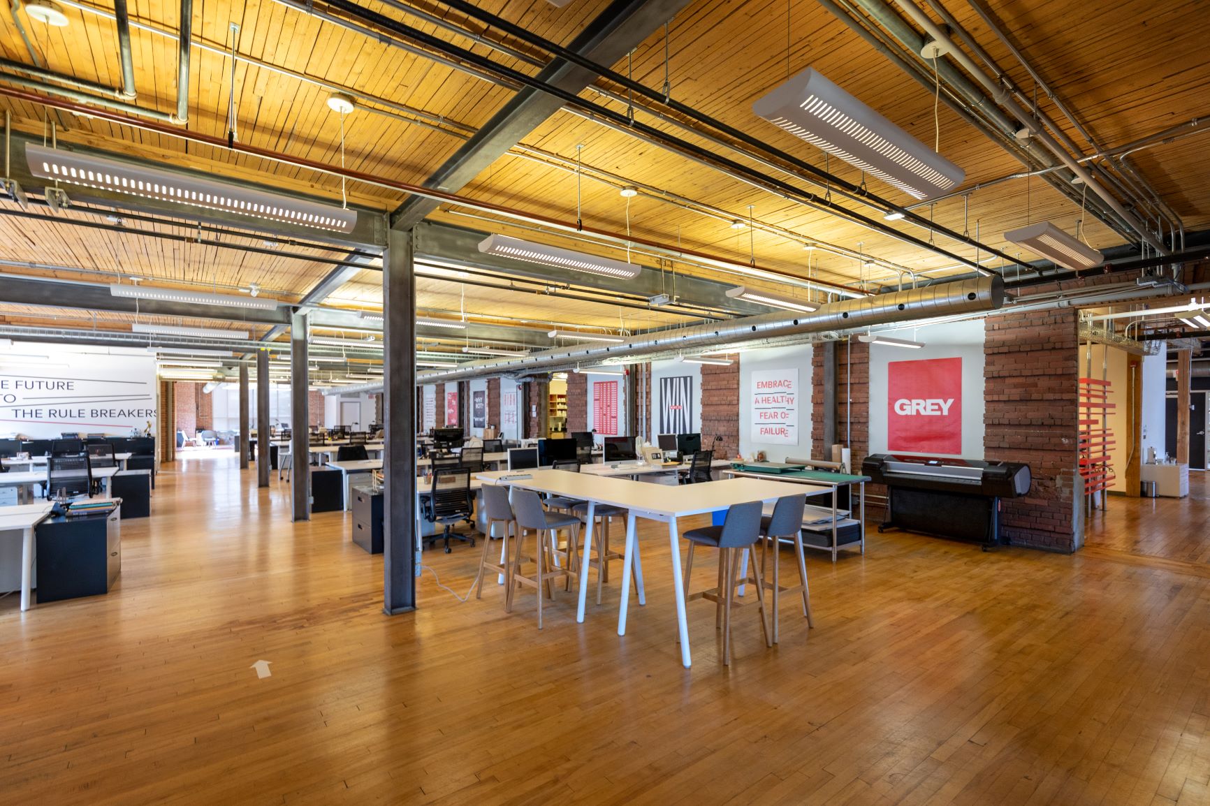 The Systems building loft office interior with brick and beam architecture